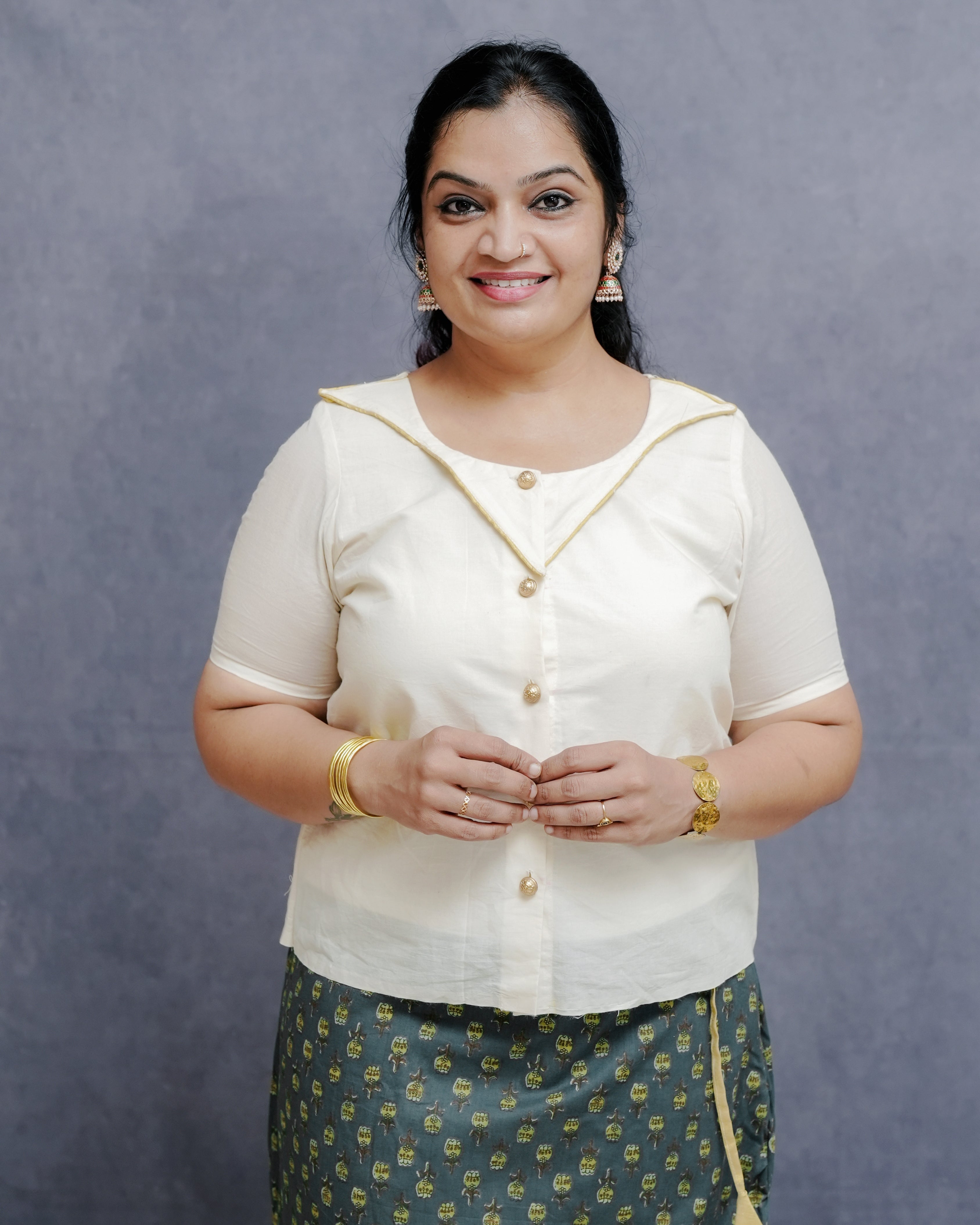 Off white Cotton Top in Golden Detailing with Printed Green Wrap around Skirt