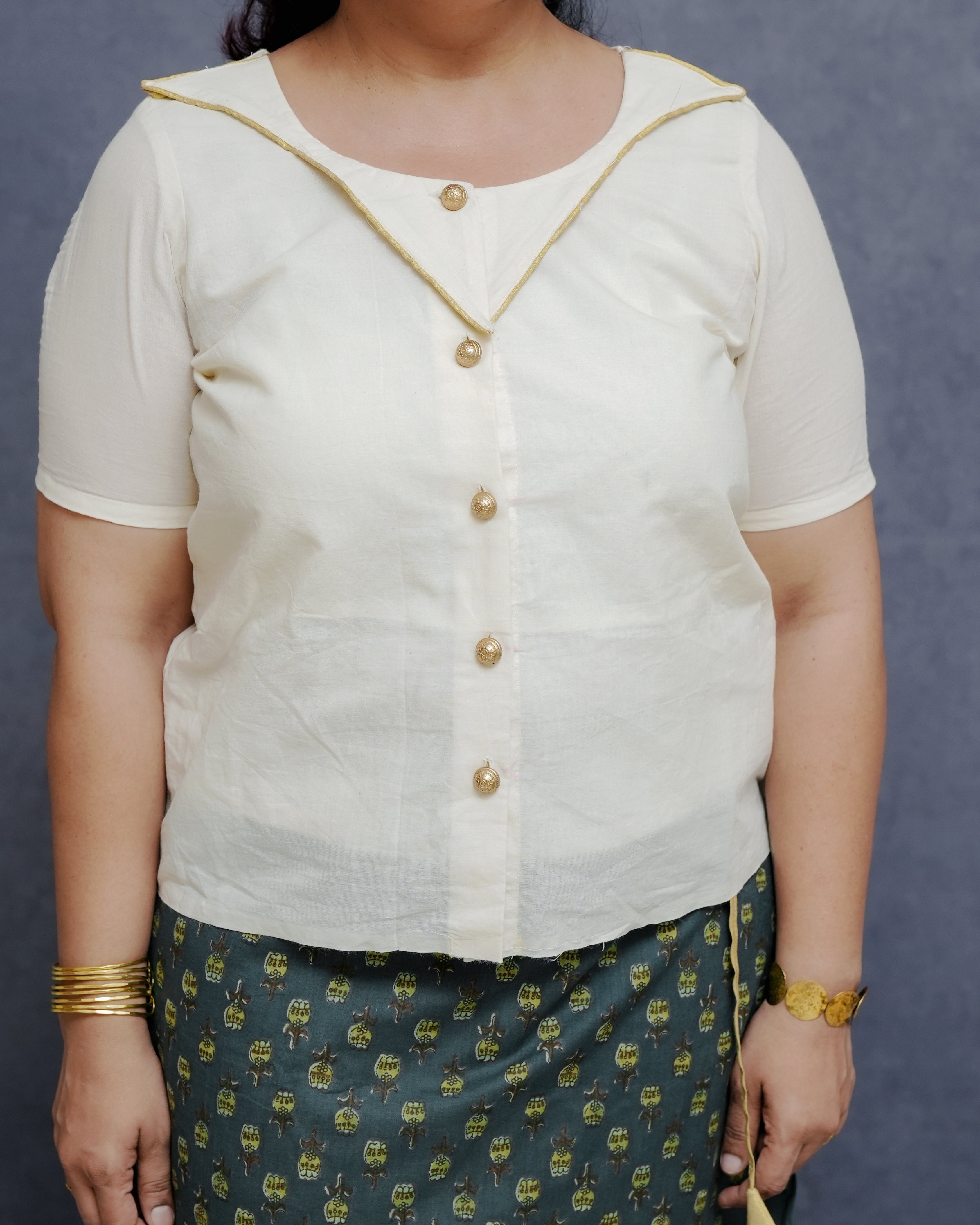 Off white Cotton Top in Golden Detailing with Printed Green Wrap around Skirt