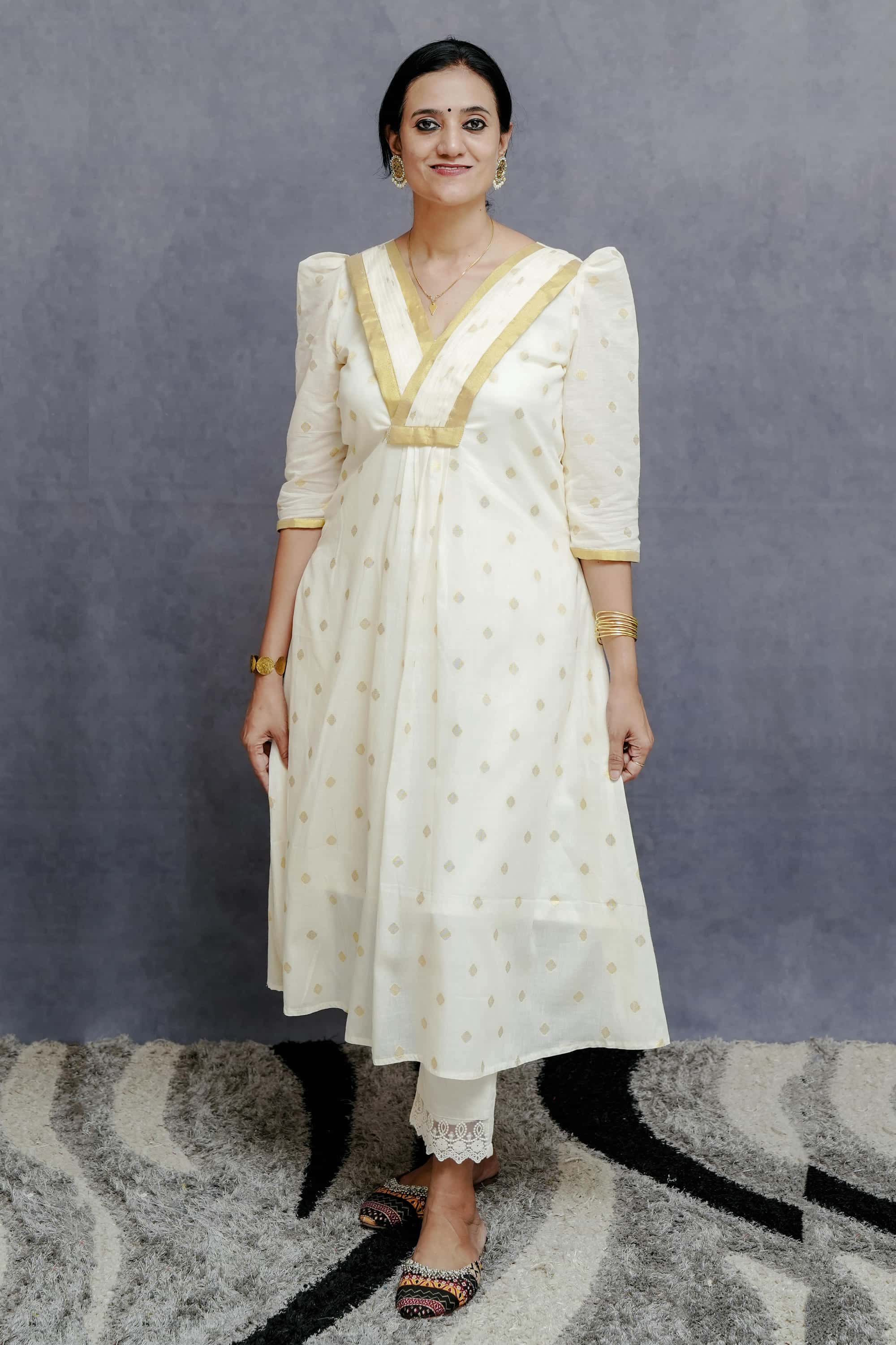 Off White A line Cotton Dress with Golden Plates & Highlights